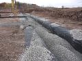 Geotextile-with-excess-and-gravel.JPG